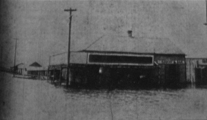 The Bruning Grocery store near the shore of Lake Pontchartrain inundated by four feet of water following the 1909 hurricane.  Source: New Orleans Daily Picayune 